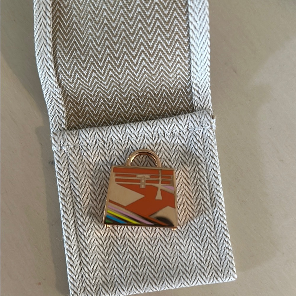 Hermes rose gold pendant/charm